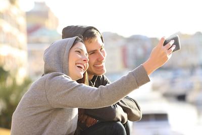 An image of a couple smiling after a Clear Aligners treatment in Erina